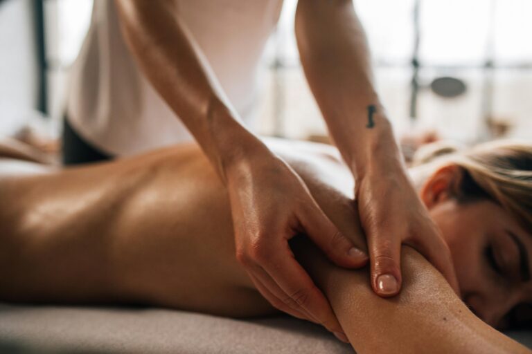 Woman receiving a Swedish arm massage at Zennergy – soothing therapeutic touch for deep relaxation and muscle relief